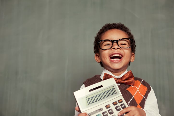 boy with autism holding calculator